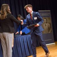 Emily shaking hands with Noah